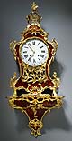A gilt bronze mounted red horn Swiss musical clock on bracket